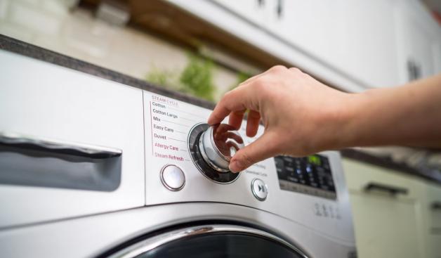 כפתור מכונת כביסה צילום: Inga,Shutterstock עיצוב הבית